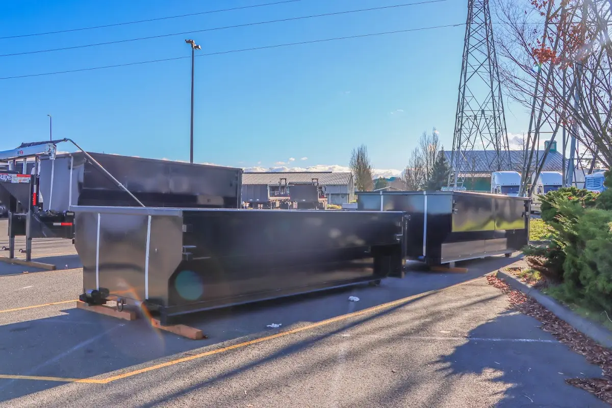 Roll-off dumpster ready for waste disposal at job site for Construction Dumpster Rental in Pine Bluff